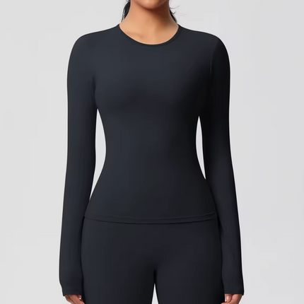 Black long-sleeve  underscrubtop worn by a person on a light gray background