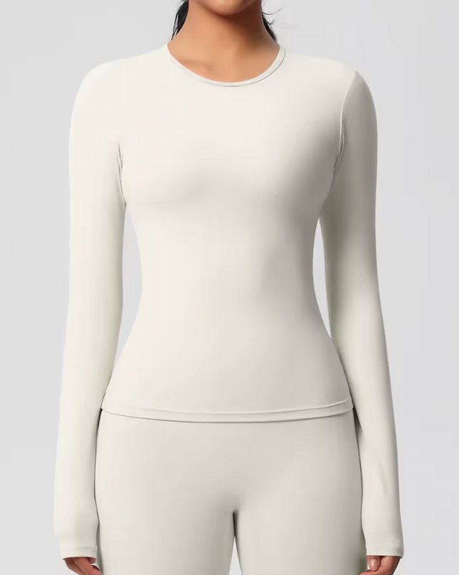 White underscrub long-sleeve top and pants set on a plain background